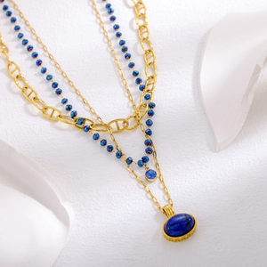 Three-layer vintage gold necklace with blue crystal beads and lapis-style pendants