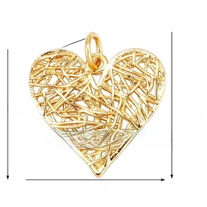 Detail of gold hollow heart pendant with wire mesh texture and precise measurements