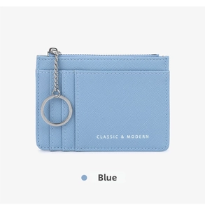 Detailed view of light blue cross-grain leather card holder with zipper and key ring