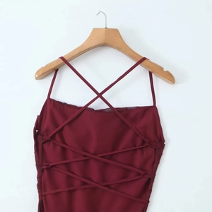Elegant wine red backless dress with adjustable crisscross strappy ties and sleek finish