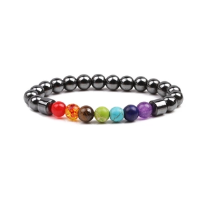 Detail of beaded chakra bracelet with crown zircon and colorful natural stones