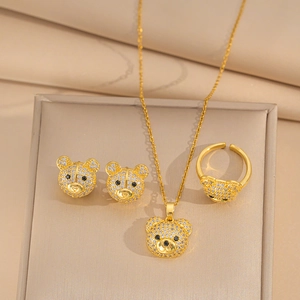 Detail of luxury gold-plated bear jewelry set with micro-paved sparkling cubic zirconia