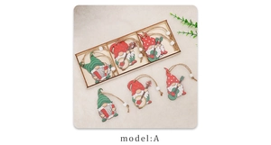 Detailed view of wooden Christmas gnome pendants with musical instruments in a wood box
