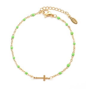 Detail of gold stainless steel bracelet with green beads and horizontal cross pendant
