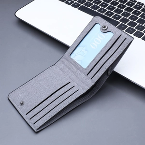Slim grey canvas wallet for men featuring multi-card slots and a clear ID window
