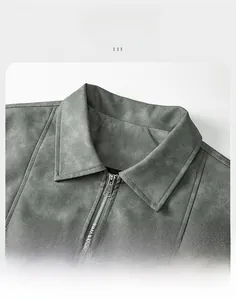Detail of gray suede jacket collar with premium silver metal zipper on white background