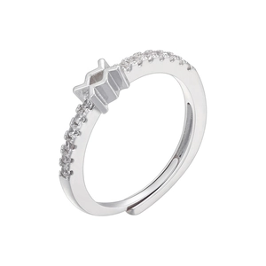 Macro detail of silver adjustable ring with four-pointed star and paved zircons