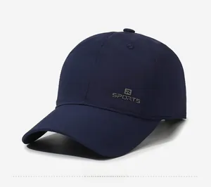 Detail view of quick-dry navy blue baseball cap with sports embroidery on a side angle