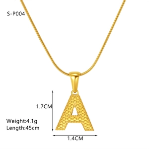 Detailed view of golden letter A pendant with embossed texture and a sleek snake chain
