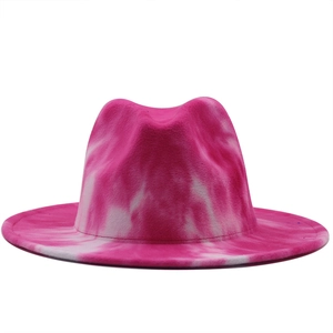 Detailed view of pink and white tie-dye wool fedora hat with wide brim texture