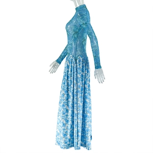 Detail of blue botanical leaf print on a slim-fit long-sleeve A-line dress