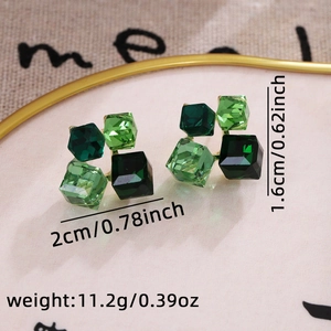 Detailed view of geometric green crystal stud earrings with precise dimensions and weight