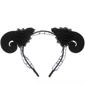 Detail of black gothic demon horn headband with lace veil and fabric flower decoration