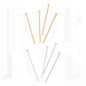 Macro view of gold and silver flat head pins for DIY jewelry making and beading