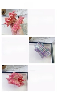 Detailed views of acetate bow hair claw clips with marble textures and metal springs