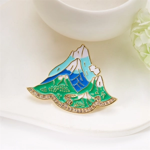 Detail of Mount Fuji enamel brooch with gold plating and sparkling rhinestones