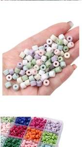 Macro view of colorful cylindrical acrylic beads in a plastic storage organizer box