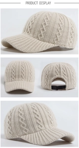 Detail of beige cable knit baseball cap with adjustable black plastic back strap