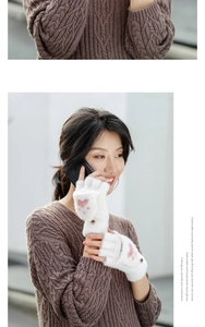 Detail of white plush convertible gloves with cat paw motif and button-back flap detail