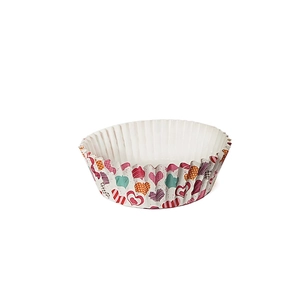 Macro detail of round oil-proof paper cupcake liners with colorful heart patterns