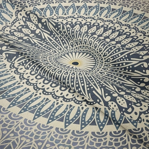 Detailed close-up showing texture and mandala pattern of Bohemian woven tapestry fabric