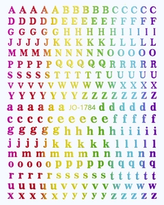 Macro view of 3D rainbow laser alphabet nail stickers showing uppercase and lowercase letters