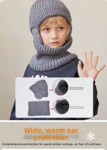 Detail of warm grey fleece lining and thick knitted texture on kids winter hat and scarf