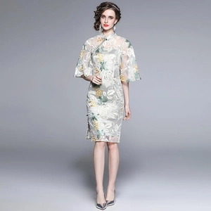 Elegant silver-white lace cheongsam dress with green floral embroidery and bell sleeves