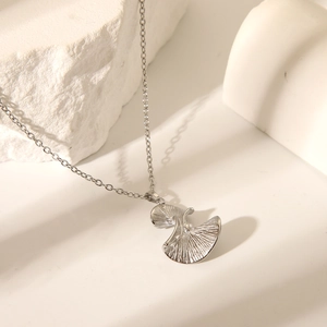 Elegant silver ginkgo leaf pendant necklace crafted in stainless steel for women