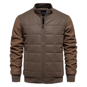 Close-up of brown quilted jacket showing stand collar and contrast sleeve textures