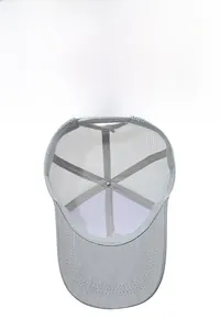 Detail view of the breathable mesh structure and interior seams of the grey trucker cap