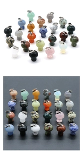 Detailed grid of assorted mini crystal mushroom pendants with metal bail attachments