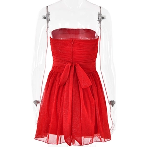 Detailed back view of red strapless mini dress with zipper and decorative bow