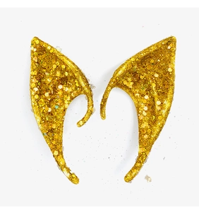 Close-up of golden glittery elf ears for Halloween cosplay with sparkling sequin texture