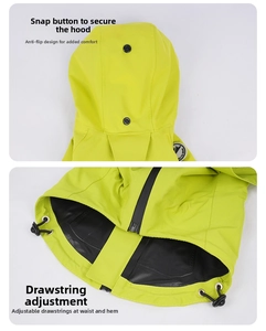 Detail of waterproof dog raincoat showing snap-button hood and adjustable drawstring hem