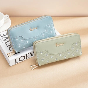 Elegant floral quilted long wallet for women with double zipper and gold logo detail