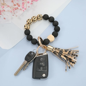 Matte black and leopard print bead keychain bracelet with wood bead and tassel