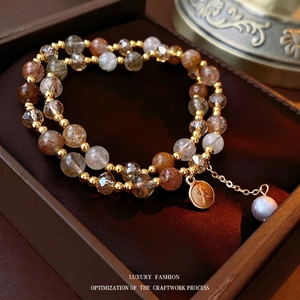 Double-layer crystal bead bracelet with gold relief coin and pearl in a jewelry box