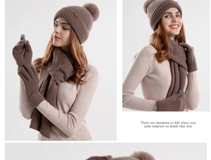 Detail view of winter knitted set featuring touch screen gloves and pompom beanie