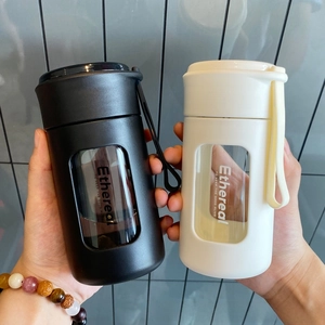 Detail of portable heat-resistant glass tea bottles with silicone straps and view windows