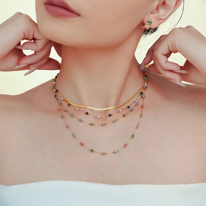 Lapis lazuli layered beaded necklace set with gold PVD plated flat snake chain on model