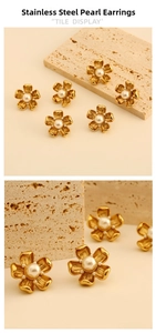 Detailed macro view of gold-plated stainless steel floral earrings with central white pearls