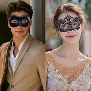Detail of elegant black lace phoenix mask and male matte eye mask for masquerade couples