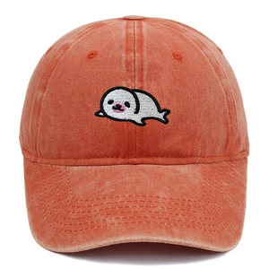 Close-up of cute cartoon seal embroidery on vintage washed cotton baseball cap