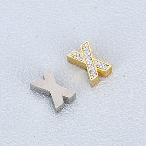 Polished stainless steel X pendant with gold plating and rhinestones inlay