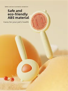 Close-up of dual pet grooming brushes made from eco-friendly ABS with fine bristles