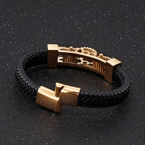 Macro view of mechanical gear elements on a black braided leather motorcycle bracelet