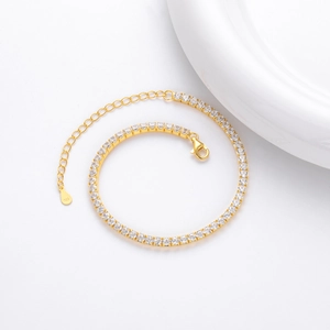 Detail of gold-plated 925 silver tennis bracelet with sparkling round-cut zircon stones