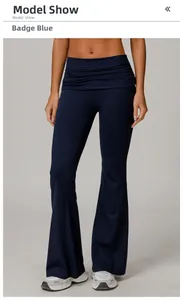 Detail of high waisted flared yoga pants in emblem blue with ruched waistband design