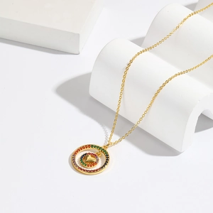 18K gold plated necklace with rainbow zircon double circle and heart pendant on white stone